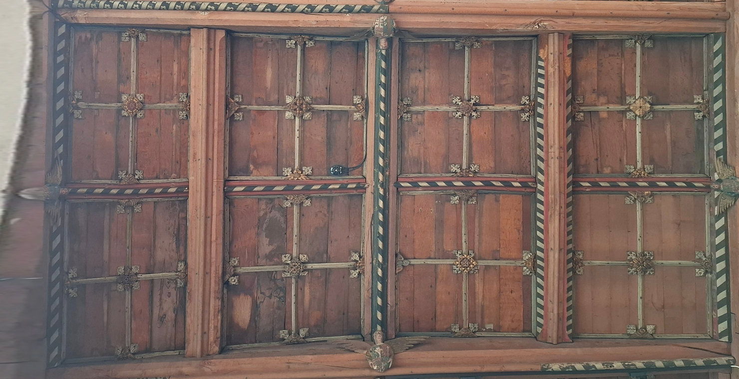 West-up photomap of ceiling bay NA2, with clickable markers for its four carved figures
